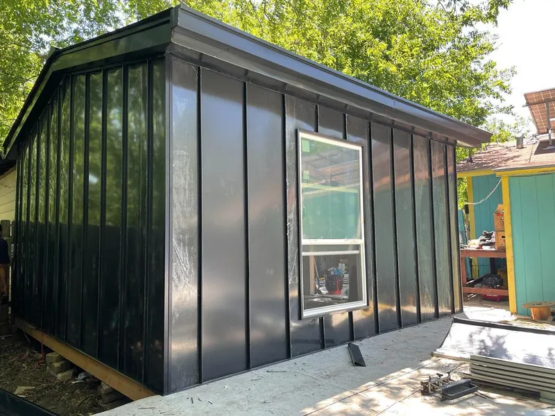 Black standing seam metal wall panels for Roof Inspection in Belle Fourche