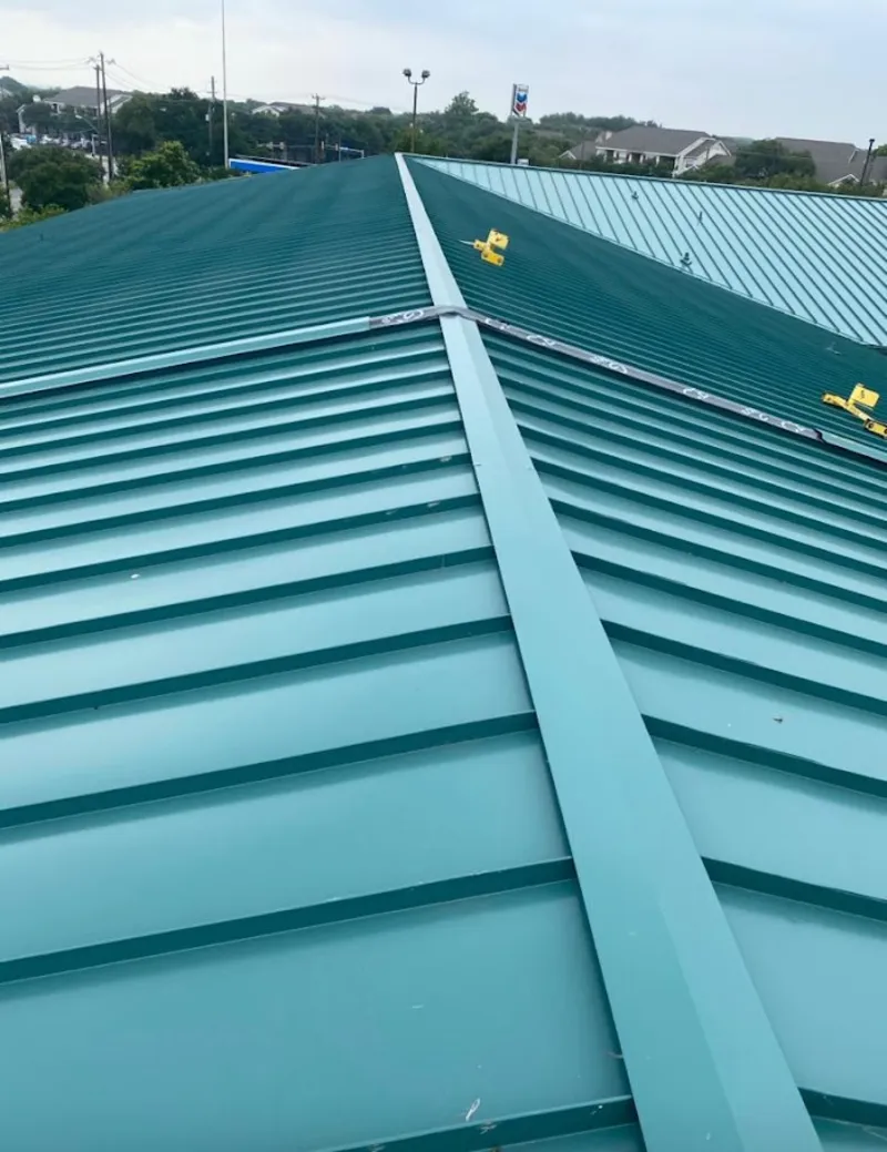 Green commercial metal roof ridge and valley for Metal Roof Repair in Belle Fourche